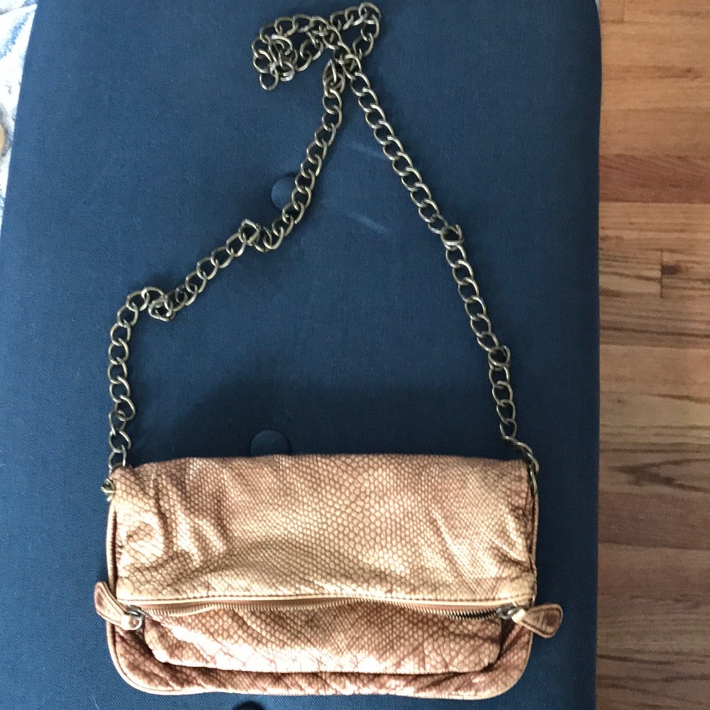 Gold bag with gold chain strap.